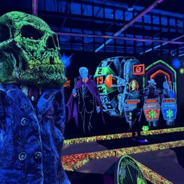 Glow in the dark decorations around a mini gold course