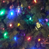 Close-up of glowing holiday lights on a Christmas tree